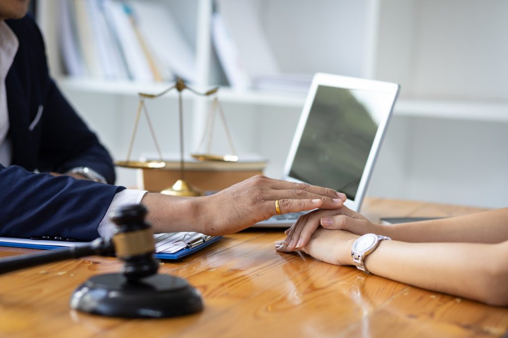 Lawyer meeting and consoling solution to his client.